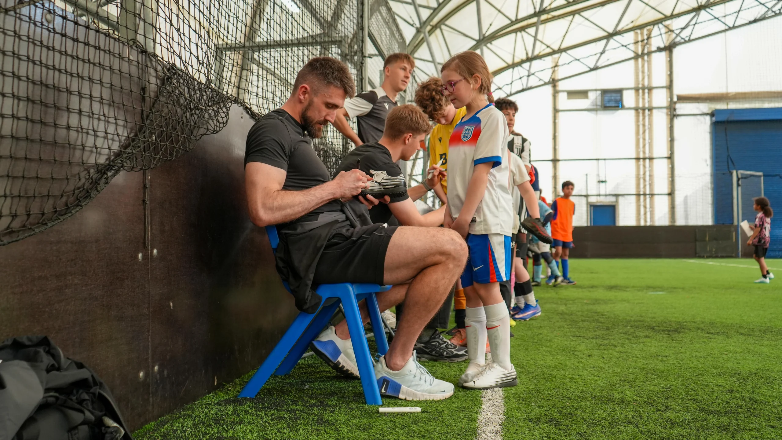 Matt Ingram signs an autograph
