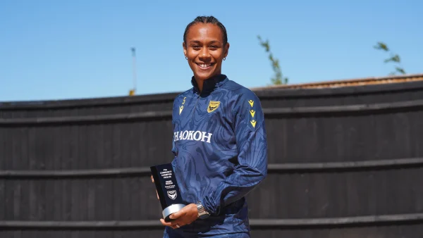 Naomi Bedeau with her award.